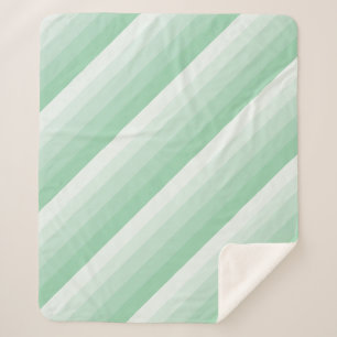 Manta Sherpa Rayas diagonales óseas en tonos verde jade