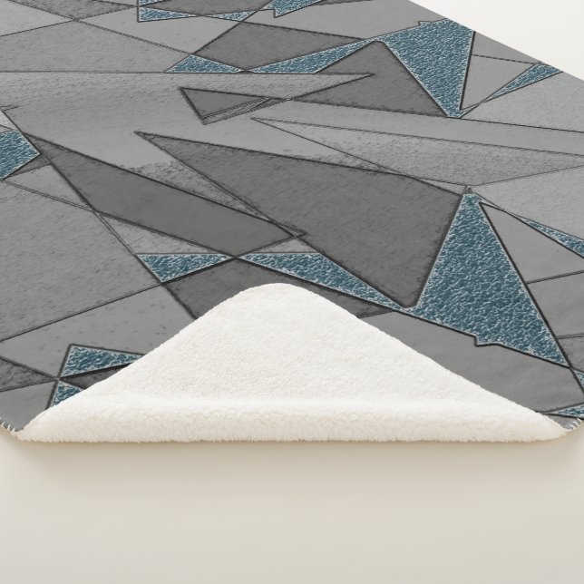 Manta Sherpa Recortes triangulares grises con trozos de azul os (3/4)