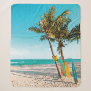 Manta Sherpa Surf board en la playa tirando almohada