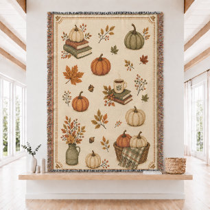Manta tejida de calabaza y libros de otoño