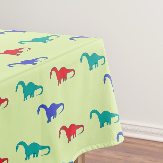 Mantel Dino colorido sobre verde (In Situ)