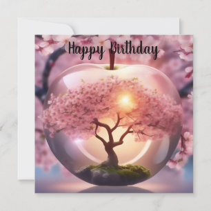 Manzana translúcida rosa con una escena de árbol d