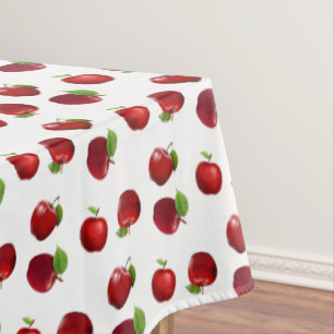 Manzanas rojas sobre mantel blanco