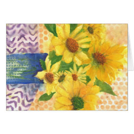 margaritas amarillas en jarrón azul