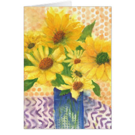 margaritas amarillas en jarrón azul