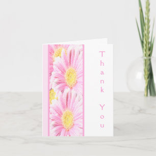 Margaritas Gerbera rosadas en tarjeta de nota blan