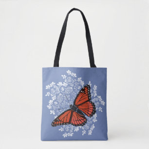 Mariposa de monarca en la bolsa de asas del cordó