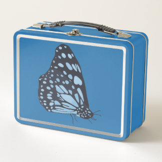 Mariposa negra con manchas azules, cajas de comida