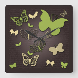 Mariposas en el reloj de pared de los tonos cálido