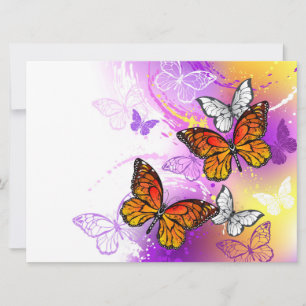 Mariposas monarcas en fondo morado