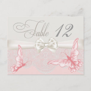 Mariposas rosadas y marfil y tarjeta de mesa de en