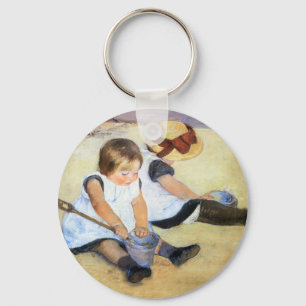 Mary Cassatt que juega en el llavero de la playa