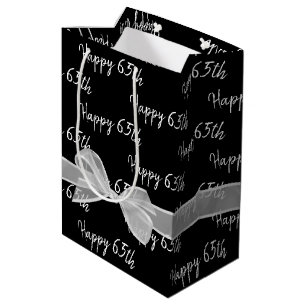 Mediana Feliz 65º cumpleaños en bolsa de regalo media negr