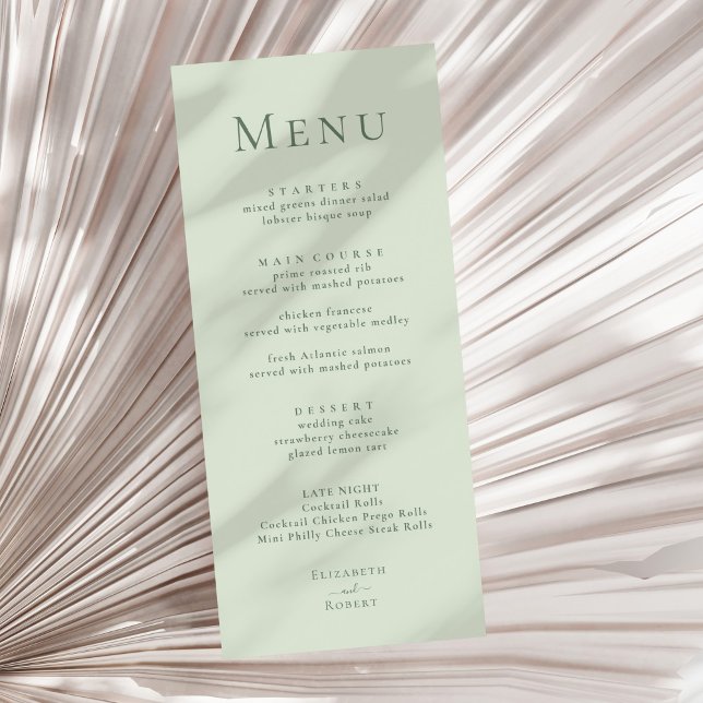 Menú de Boda Minimalista Moderno Verde Claro Salvi (Pale Sage Green Modern Minimalist Wedding Menu on a sunny neutral dry palm leaf.)