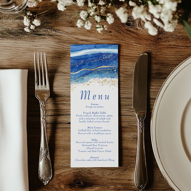 Menú Elegante acuarela azul y dorada (Wedding reception dinner menu with blue text and a top border of blue and gold splatters)