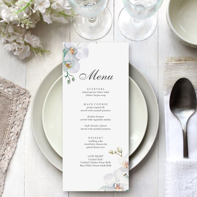 Menú Moderno Boda elegante de orquídeas salvajes (Modern Elegant Wild Orchid Wedding Menu on a beautiful white and silver wedding dinner table.)