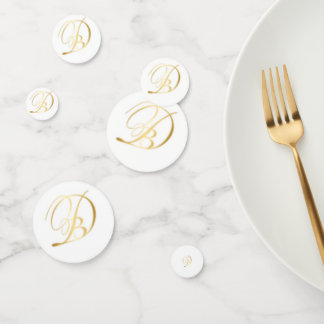 Mesa de confeti monogramada para la cena en Blanc