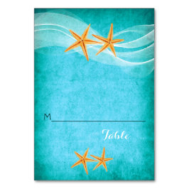 Mesa Par Starfish y tarjeta de lugar de boda velo playa