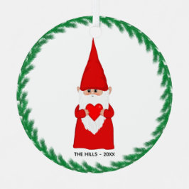 Metálico Gnomo de Navidad sosteniendo un adorno de metal en