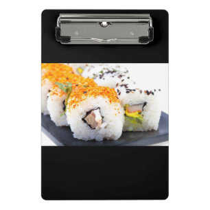 Minicarpeta De Pinza Sushi en un plato