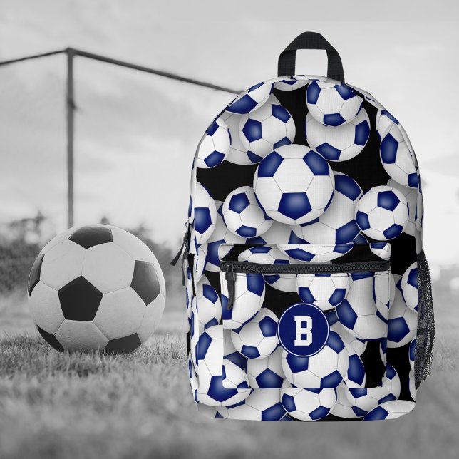 Mochila Impresa atletas monogramando balones de fútbol blanco azul (Front view soccer backpack with athlete monogram & pattern of blue & white team color soccer balls)