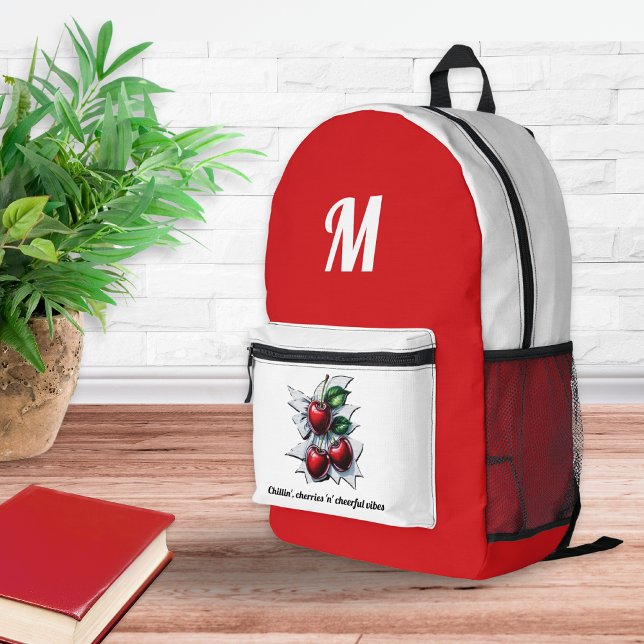Mochila Impresa Cerezas Veraniegas de Moda Rojas y Blancas con Mon (A red and white backpack with monogram initial, cherries motif and caption)