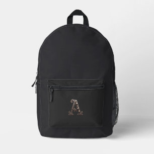 Mochila Impresa Letra A de bronce ornamentada con campanas