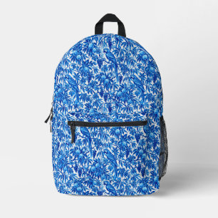 Mochila Impresa Loros Azules en un Jardín Tropical