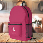 Mochila Impresa Monograma tipográfico femenino de color rosa calie<br><div class="desc">Un diseño vertical minimalista en un estilo elegante con un color de característica rosada caliente y un monograma inicial tipográfico grande. El texto puede ser fácilmente personalizado para un diseño tan único como usted!</div>