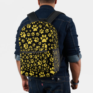 Mochila Impresa Patrón de patas de metal dorado sobre fondo negro