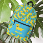 Mochila Impresa Perros plásticos tropicales de banana con estampad<br><div class="desc">¿Has visto alguna vez una mochila que sea más banana? ¡Es un perro! ¡Es un plátano! ¡Son perros hechos de plátanos! Estos perros amarillos de estilo dachshund, hechos de fruta, se acompañan de hojas de palma verdes, con un fondo azul brillante. Esta mochila está lista para ser personalizada con un...</div>