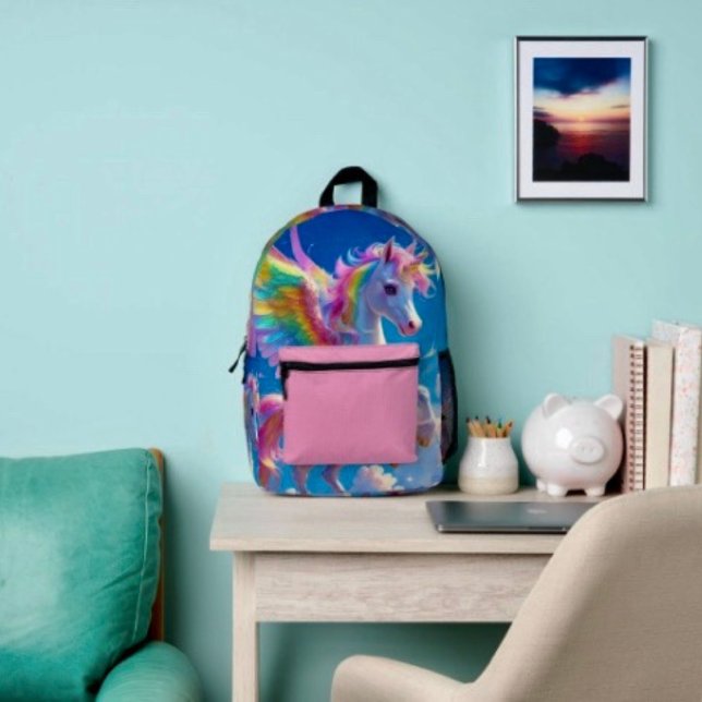 Mochila Impresa Unicornio danzante con alas de arcoíris  (Backpack – D: 17"x12.5"x5" Two-chamber design with laptop storage pouch. Mesh side pocket.
)