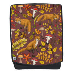 Mochila zorros otoñales sobre marrón chocolate