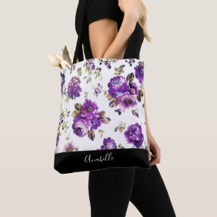 Modelo de flores púrpura con la bolsa de asas del