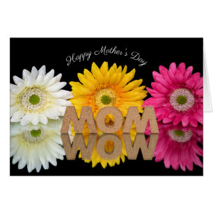 MOM-WOW con reflexión floral sobre el espejo negro