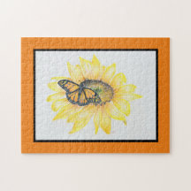 Monarca del rompecabezas sobre el girasol