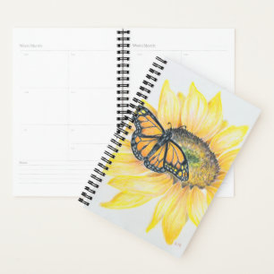 Monarca y girasol de pequeño planificador