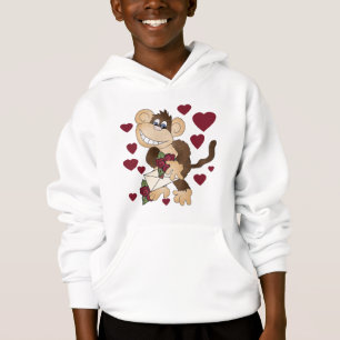Mono con las camisetas y los regalos de los rosas