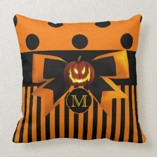 Monograma de la almohada del naranja y del negro