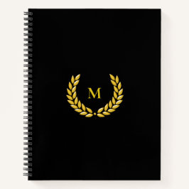 Monograma y laurel en cuaderno negro