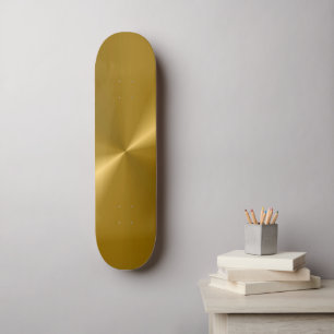 Monopatín metálico del oro