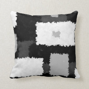 Monótono en las almohadas grises, negras y blanca