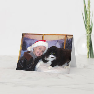 Muchacho con el gato en el navidad