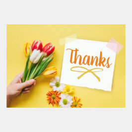 Muchas gracias con flores y nota