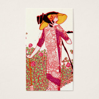Mujer Art Nouveau de moda en un jardín Rosa