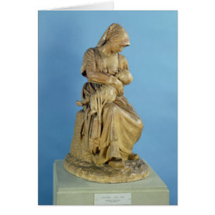 Mujer campesina que alimenta a su niño