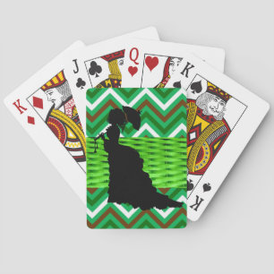 Mujer victoriana verde en juego con cartas