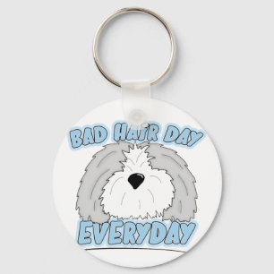 Mún llavero del perro pastor del día del pelo