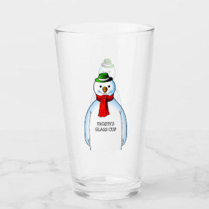 Muñeco de nieve alegre en una taza de vidrio de Na