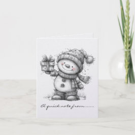 Muñeco de nieve blanco y negro y regalo